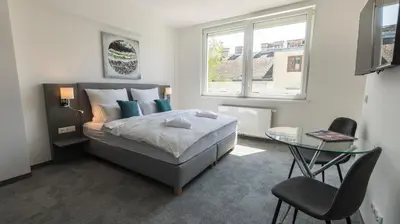 Ein Bett oder Betten in einem Zimmer der Unterkunft Cube Apartments by Wiener Stadthalle & U3 Metro