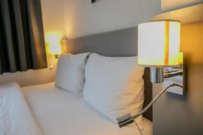 Ein Bett oder Betten in einem Zimmer der Unterkunft Cube Apartments by Wiener Stadthalle & U3 Metro