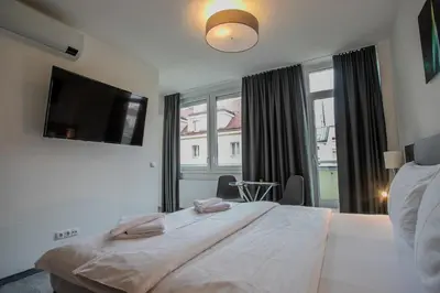 Ein Bett oder Betten in einem Zimmer der Unterkunft Cube Apartments by Wiener Stadthalle & U3 Metro