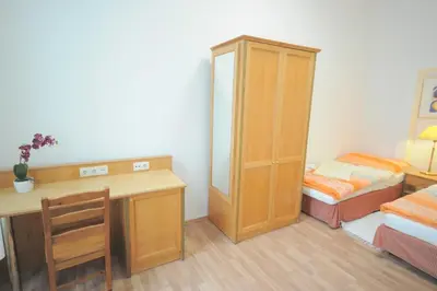 Ein Bett oder Betten in einem Zimmer der Unterkunft Ferienwohnung Schloessel 26/18