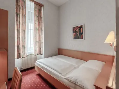 Ein Bett oder Betten in einem Zimmer der Unterkunft Hotel Admiral