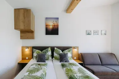 Ein Bett oder Betten in einem Zimmer der Unterkunft Sonnenweg Appartements