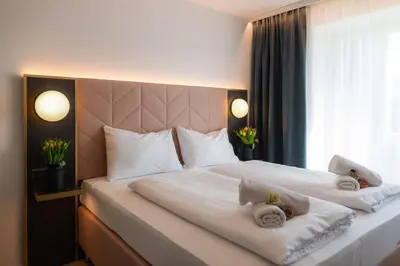 Ein Bett oder Betten in einem Zimmer der Unterkunft Florum Hotel