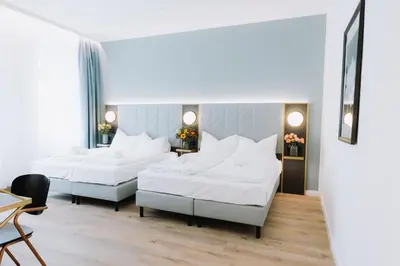 Ein Bett oder Betten in einem Zimmer der Unterkunft Florum Hotel