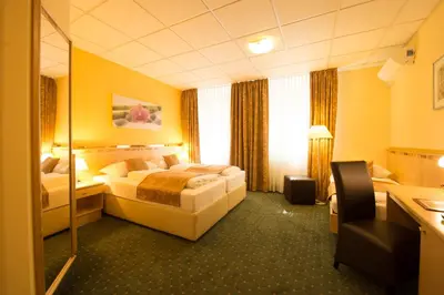 Ein Bett oder Betten in einem Zimmer der Unterkunft Hotel Beethoven