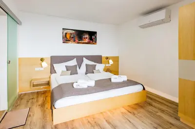Ein Bett oder Betten in einem Zimmer der Unterkunft Winzerhof Lentsch