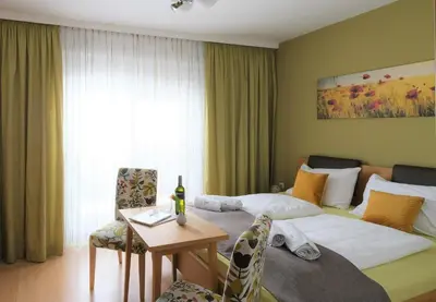 Ein Bett oder Betten in einem Zimmer der Unterkunft Winzerhof Lentsch