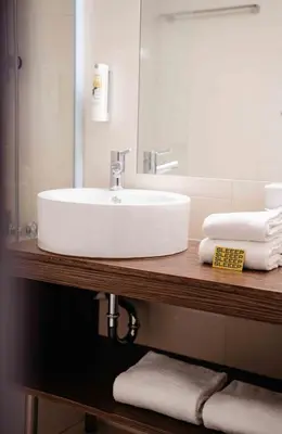Ein Badezimmer in der Unterkunft SLEEEP Hotel Vösendorf