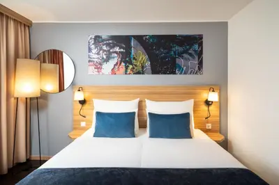 Ein Bett oder Betten in einem Zimmer der Unterkunft Leonardo Hotel Vienna Schönbrunn