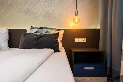 Ein Bett oder Betten in einem Zimmer der Unterkunft Mariahilf Suites