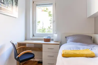 Ein Bett oder Betten in einem Zimmer der Unterkunft Town House near Metro & Vienna City Center