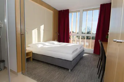 Ein Bett oder Betten in einem Zimmer der Unterkunft Hubertushof Fromwald Hotel und Gasthof