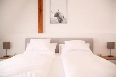 Ein Bett oder Betten in einem Zimmer der Unterkunft Haus56