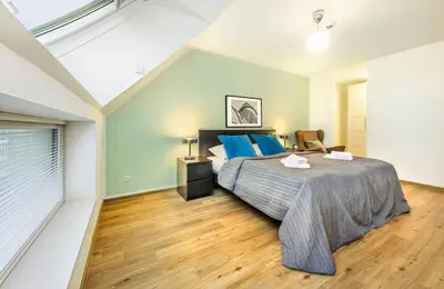 Ein Bett oder Betten in einem Zimmer der Unterkunft Jimmy's Apartments Lory