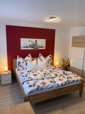 Ein Bett oder Betten in einem Zimmer der Unterkunft Ferienwohnungen zum Briefmarkenhaus