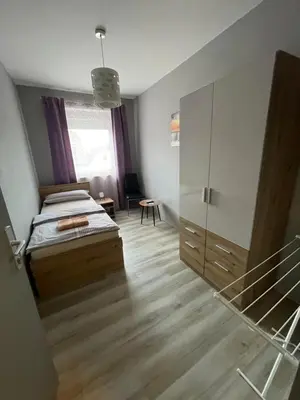 Ein Bett oder Betten in einem Zimmer der Unterkunft Privatzimmer Hammrich