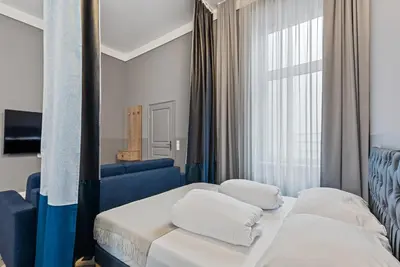 Ein Bett oder Betten in einem Zimmer der Unterkunft KH Opera Apartments
