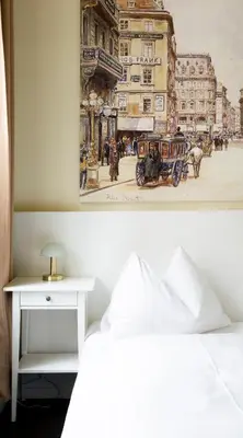 Ein Bett oder Betten in einem Zimmer der Unterkunft Boutique Hotel Columbia