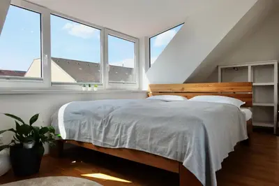 Ein Bett oder Betten in einem Zimmer der Unterkunft Triple A Apartments