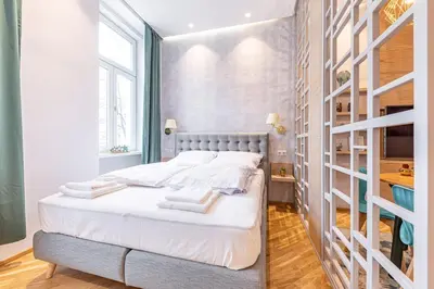 Ein Bett oder Betten in einem Zimmer der Unterkunft ZEUS Design Apartments