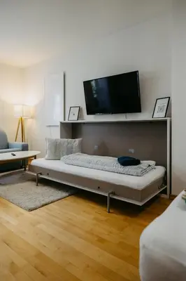 Ein Bett oder Betten in einem Zimmer der Unterkunft Ferienwohnung Dado