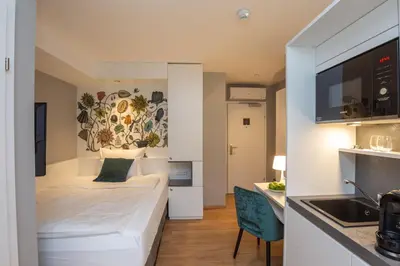 Ein Bett oder Betten in einem Zimmer der Unterkunft Wilmas Apartments by Arbio