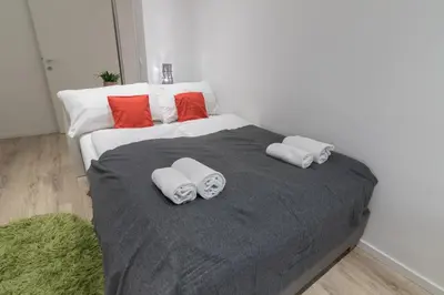 Ein Bett oder Betten in einem Zimmer der Unterkunft Yeshello Belvedere Apartment