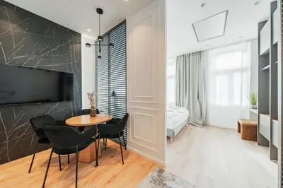 Ein Bett oder Betten in einem Zimmer der Unterkunft Zeus Design Apartments Schönbrunn