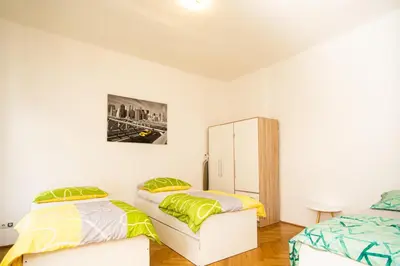 Ein Bett oder Betten in einem Zimmer der Unterkunft Raimond Apartment Ottakring Top 22