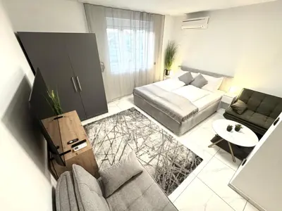 Ein Bett oder Betten in einem Zimmer der Unterkunft 25h SPA-Residenz POOLs IN & OUT, private Garden or Balcony