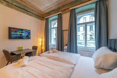 Ein Bett oder Betten in einem Zimmer der Unterkunft josef's home I Renaissance Studio