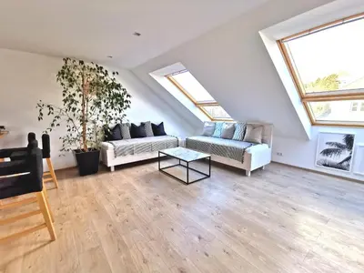 Ein Sitzbereich in der Unterkunft Lieblingsplatz Neusiedl - Modern Stylish Apartments - Free Parking Burgenland Card - 10 min to Designer Outlet Parndorf and Lake Neusiedl