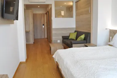 Ein Bett oder Betten in einem Zimmer der Unterkunft Seehotel Herlinde