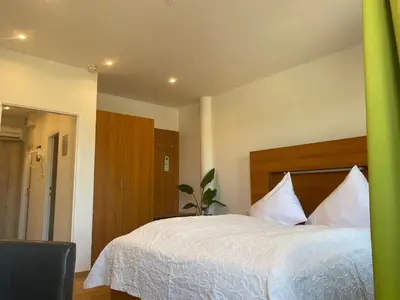 Ein Bett oder Betten in einem Zimmer der Unterkunft Seehotel Herlinde