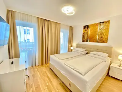 Ein Bett oder Betten in einem Zimmer der Unterkunft Steiner Residences Vienna Nestroyplatz