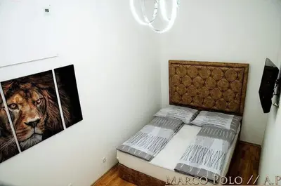 Ein Bett oder Betten in einem Zimmer der Unterkunft MarkoPolo Apartments