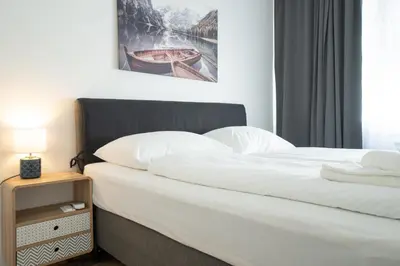 Ein Bett oder Betten in einem Zimmer der Unterkunft Charming Apartment with Balcony, Close to Stephansdom Cathedral