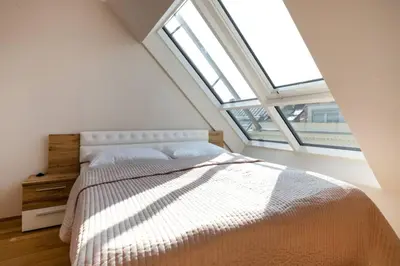 Ein Bett oder Betten in einem Zimmer der Unterkunft Großes Penthouse #12 mit Terrasse und Aussicht
