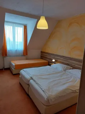 Ein Bett oder Betten in einem Zimmer der Unterkunft Pension Claudia