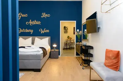 Ein Bett oder Betten in einem Zimmer der Unterkunft La Vienna Suites - Apartments Hauptbahnhof