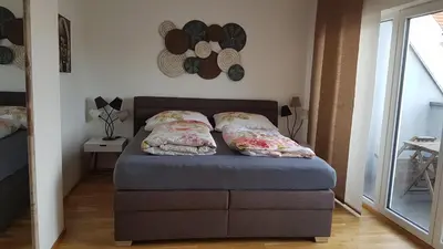 Ein Bett oder Betten in einem Zimmer der Unterkunft Moderne Maisonette mit Terrasse