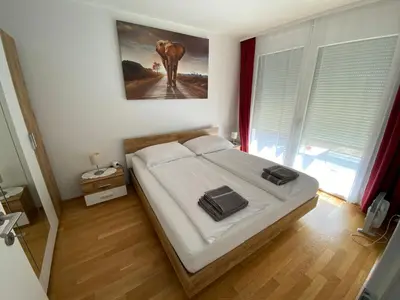 Ein Bett oder Betten in einem Zimmer der Unterkunft Neubau Wohnung Stadlau