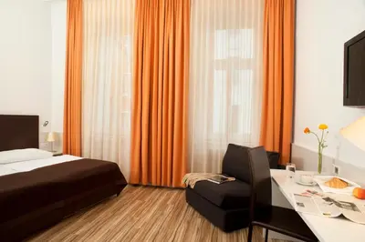 Ein Bett oder Betten in einem Zimmer der Unterkunft Hotel Zipser