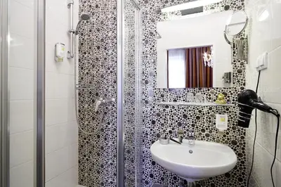 Ein Badezimmer in der Unterkunft BoutiqueHOTEL Donauwalzer