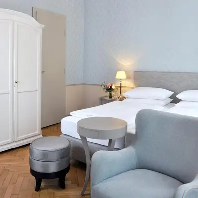 Ein Bett oder Betten in einem Zimmer der Unterkunft Hotel Kärntnerhof