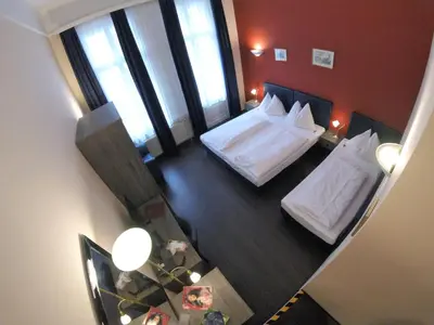 Ein Bett oder Betten in einem Zimmer der Unterkunft Hotel Pension Excellence