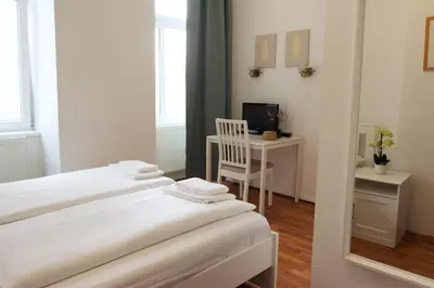 Ein Bett oder Betten in einem Zimmer der Unterkunft Hotel Pension ARPI