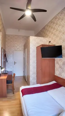Ein Bett oder Betten in einem Zimmer der Unterkunft HPA Hotel Andreas