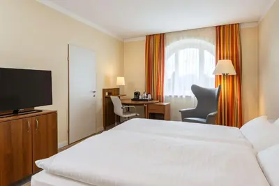Ein Bett oder Betten in einem Zimmer der Unterkunft NH Wien Belvedere