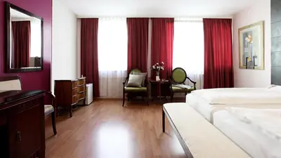 Ein Bett oder Betten in einem Zimmer der Unterkunft Hotel Attaché l contactless check-in